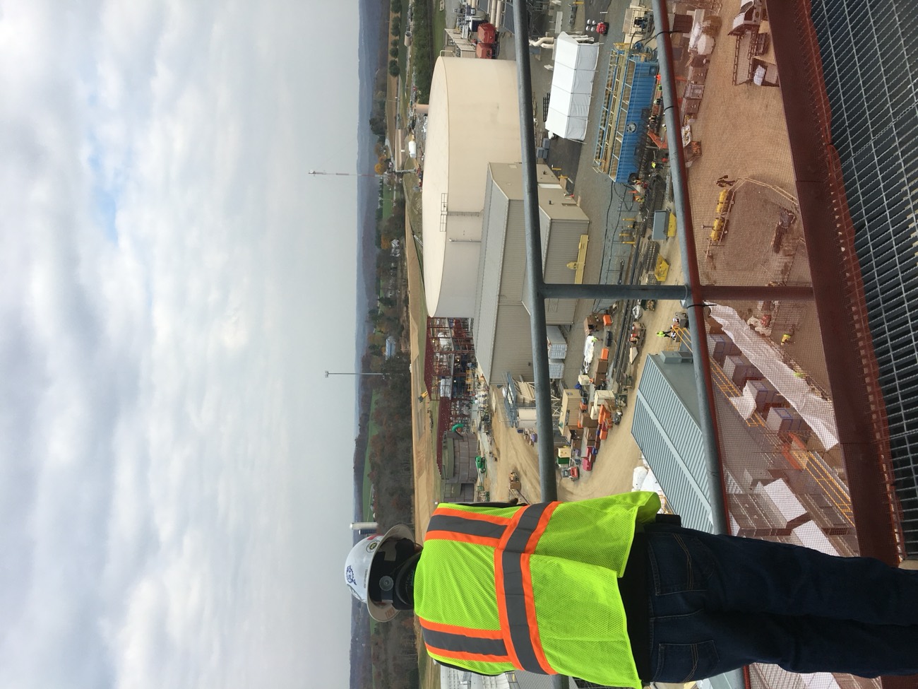 Site supervisor overlooking an industrial facility